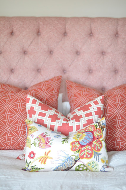 Luscious cushions and pink tufted bedhead via Caitlin Wilson Design