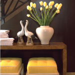 Yellow tulips and yellow stools in entryway