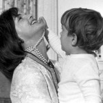 Jacqueline Kennedy playing with toddler John Jr