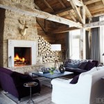 Stone fireplace with logs in country house