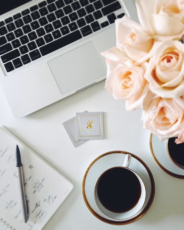 Coffee - china - laptop - paper - pen - flowers - vignette