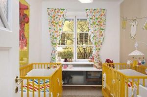 double-yellow-cribs-twins-baby-nursery.jpg
